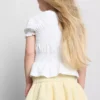 1,5-9 años | Top con peplum fruncido