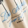 7-15 años | Camiseta con estampado de palmeras y textura