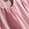 Blusa con mangas abullonadas texturizadas