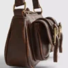 Bolso de hombro con bolsillo y hebilla