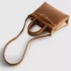 Bolso mini con detalle de hebilla