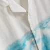 Camisa de manga corta con botones y estampado panorámico
