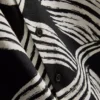 Camisa de manga corta con estampado abstracto de hojas