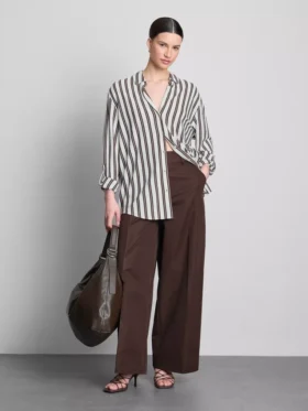 Camisa holgada con botones y dobladillo curvo