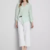 Camisa holgada con botones y dobladillo curvo