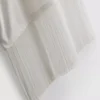 Camiseta asimétrica de algodón con flecos