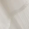 Camiseta asimétrica de algodón con flecos