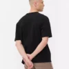 Camiseta de algodón de corte holgado con cuello ribeteado