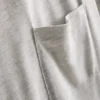 Camiseta larga con bolsillo de parche
