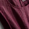 Camiseta sin mangas con bajo peplum a rayas