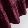 Camiseta sin mangas con bajo peplum a rayas