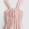Camiseta sin mangas con bajo peplum fruncido