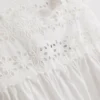 Camiseta sin mangas con inserción bordada