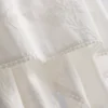 Camiseta sin mangas de algodón con bajo en forma de pañuelo