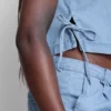 Camiseta sin mangas de denim de algodón con lazos laterales
