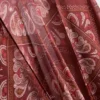 Capa con flecos y estampado de cachemira