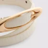 Cinturón fino con hebilla ovalada