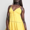 Minivestido de algodón con cuello en V y volantes