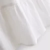 Minivestido de algodón con cuello en V y volantes