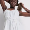 Minivestido de popelín con volantes y tirantes