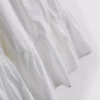Minivestido de popelín con volantes y tirantes