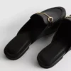 Mules de piel sintética con detalle de bocado de montura