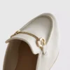 Mules de piel sintética con detalle de bocado de montura
