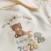 Pack de 2 baberos envolventes «Born in 2026»
