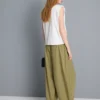 Pantalones acampanados plisados con tacto de papel