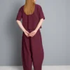 Pantalones acampanados plisados con tacto de papel