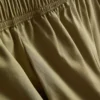 Pantalones acampanados plisados con tacto de papel