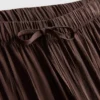 Pantalones anchos con textura y cordón