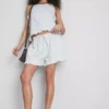 Pantalones Cortos vaqueros con volantes en el bajo