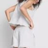 Pantalones Cortos vaqueros con volantes en el bajo