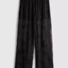 Pantalones de malla con abalorios y pierna ancha de Paula Echevarría