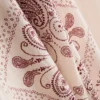 Pantalones de pierna ancha de satén arrugado de Paula Echevarría