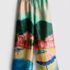 Pantalones de playa de satén con estampado panorámico