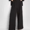 Pantalones holgados con textura y cintura media