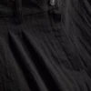 Pantalones holgados con textura y cintura media