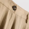Pantalones holgados con textura y cintura media