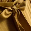 Pantalones palazzo con detalle de lazo