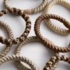 Paquete de 10 gomas trenzadas para el pelo