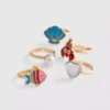 Paquete de 5 anillos con dijes marinos