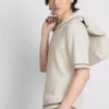 Polo con cremallera y textura «The Edit»