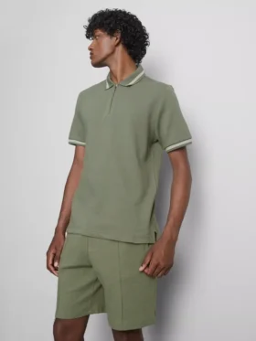 Polo con cuello de cremallera y textura