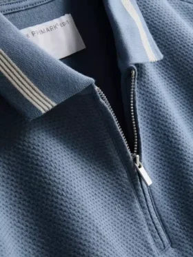 Polo con cuello de cremallera y textura
