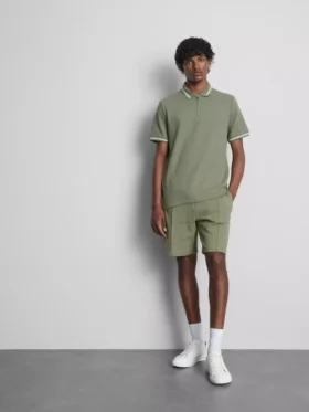 Polo con cuello de cremallera y textura