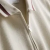 Polo con cuello de cremallera y textura