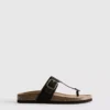 Sandalias tipo mule con barra en T y hebilla