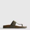 Sandalias tipo mule con barra en T y hebilla
